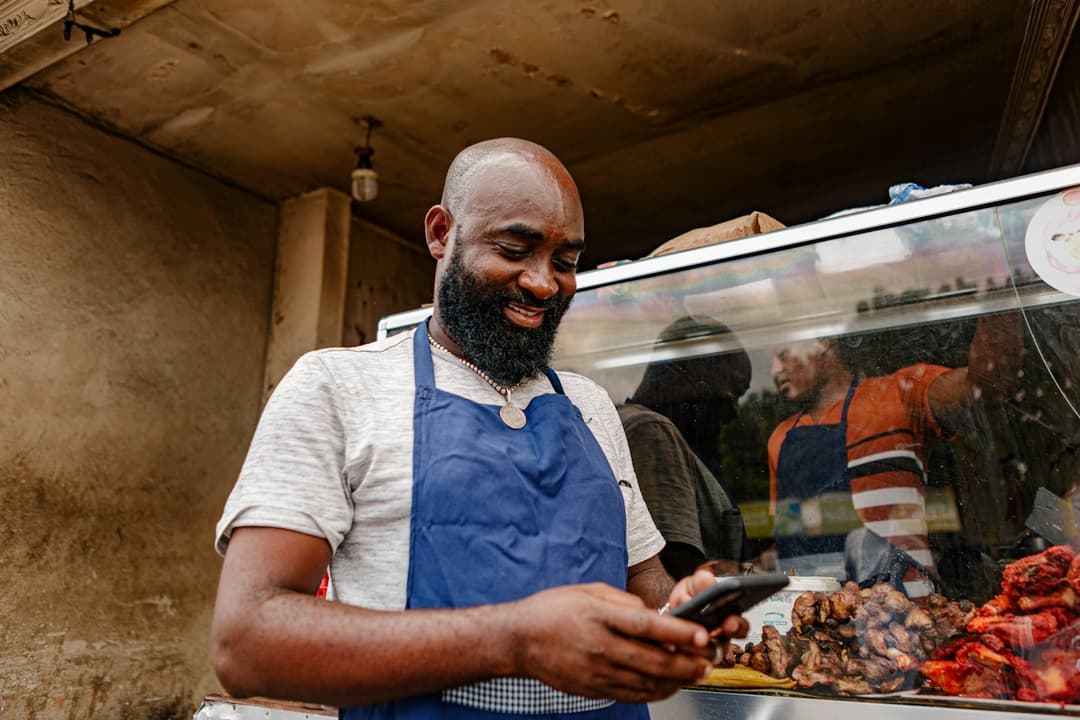 Vendor receiving payment on their phone